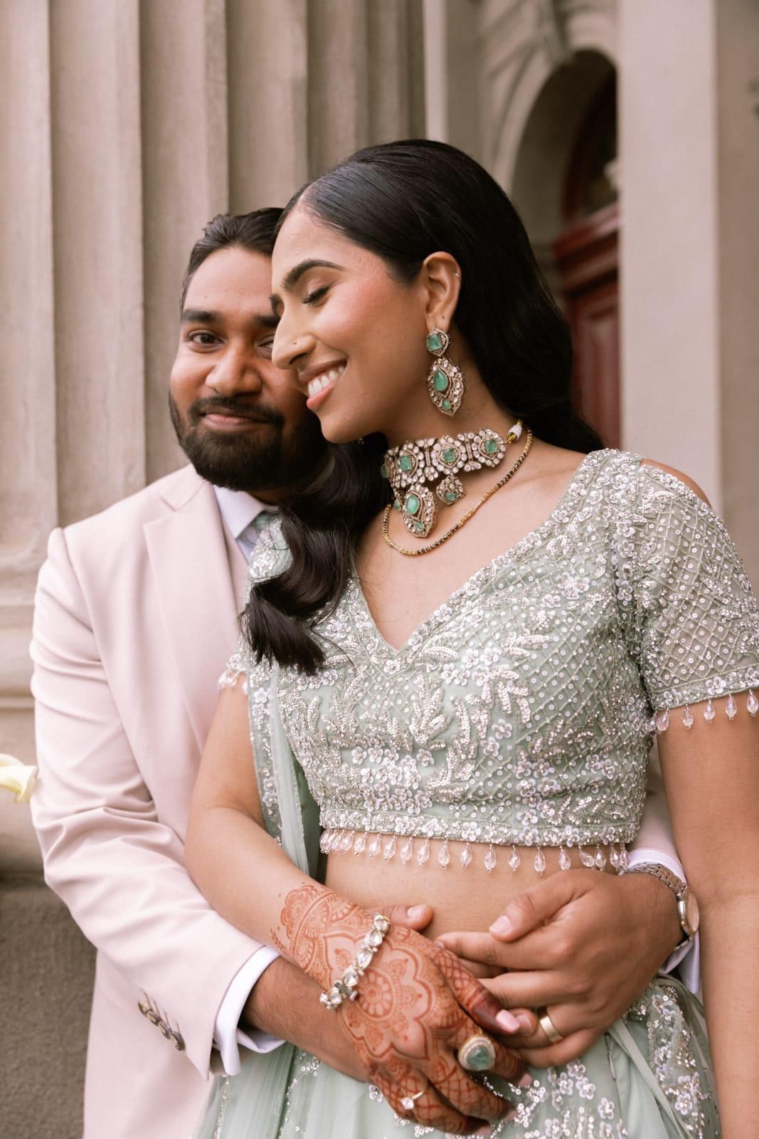Bride and groom - sage green lehenga with emerald kundan necklace